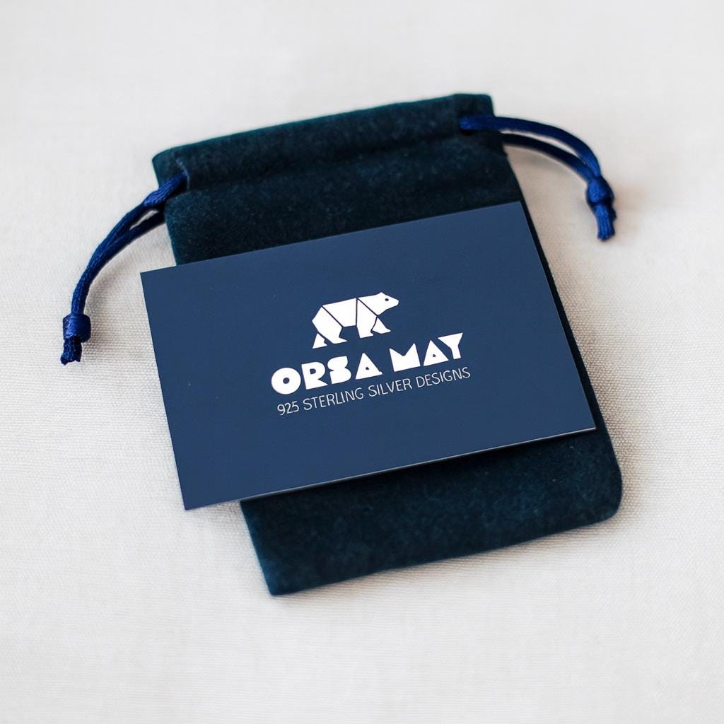 Sterling Silver Kiss Earrings: Cubic Zirconia X Studs